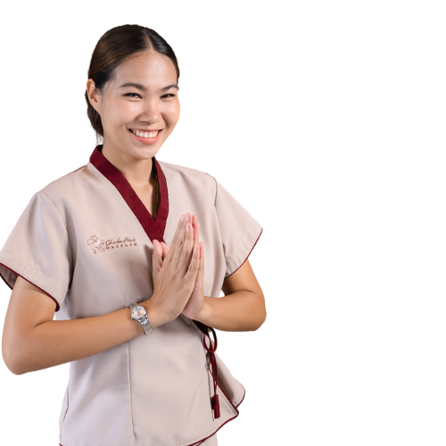 Friendly Thai spa therapist welcoming guests with traditional wai greeting
